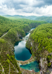 Amazing aerial view of Plitvice national park with lakes and picturesque waterfalls in a green spring forest, Croatia. - 762491229