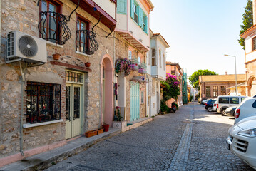 Balikesir, Ayvalık TURKEY. July 26, 2022.  Ayvalik Town old streets view. Ayvalik is populer tourist destination in Turkey. - obrazy, fototapety, plakaty