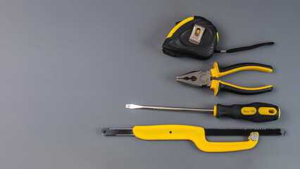 Carpentry tools on a gray background