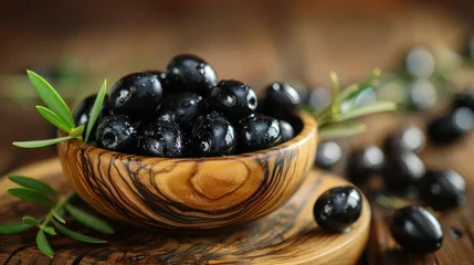 Foto op Plexiglas Wooden Bowl Filled With Black Olives on Wooden Table © Royal Ability