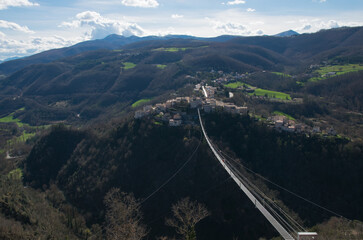 Panoramic view of the highest Tibetan bridge in Europe in the small town of Sellano, Umbria region, Italy - 762503487
