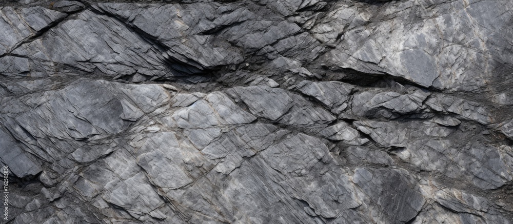 Aufkleber a closeup of a grey bedrock with intricate crack patterns, resembling a composite material. it is a 