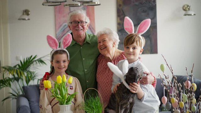 Easter video of grandparents with grandchildren before traditional easter lunch. Recreating family traditions and customs. Happy easter.