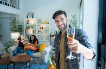 Multiethnic friends had fun party and drinking wine at home.