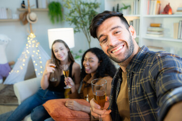 Multiethnic friends had fun party and drinking wine at home.