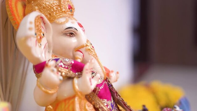 Close up View of Ganesha Statue Decorated for Hindu Rituals, Clay statue of Lord Ganesha,  Hindu Ganesh Chaturthi Festival in India - Colorful Indian God background