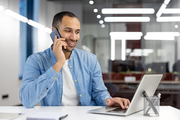 Busy professional multitasking in a modern office