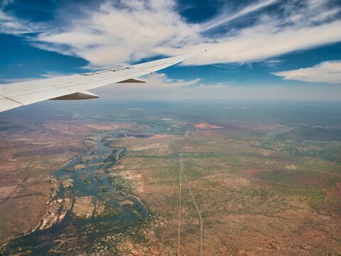 Passenger window view of Zambezi River while approahing Victoria Falls Airport (VFA) 