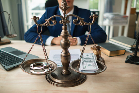 The concept of defendants in serious cases bribing officials involved in court decisions to change the course of case by giving bribes to facilitate the Lawyer team and prosecutors. bribery concept