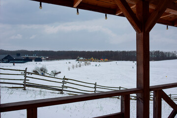 View from the gazebo on the snow-covered territory of the park