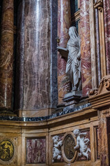 Detail of church Santa Maria Maddalena dei Pazzi with veiled statue of penance among colored marble, Florence ITALY