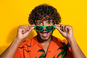 Portrait of impressed guy with afro hair wear hawaii shirt touch glasses staring at unbelievable...