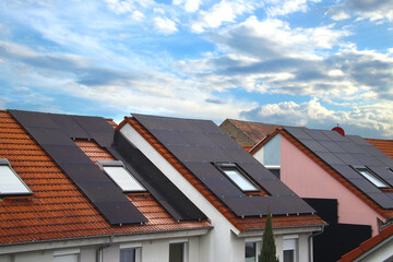 View at solar panels on several pitched roofs of townhouses , Germany - 762544078