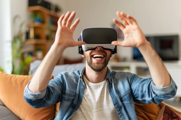 Happy man showing virtual reality glasses sitting on a sofa in the living room at home