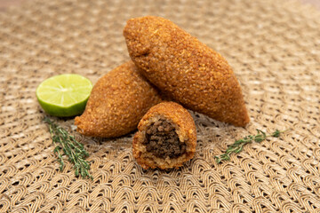 Kibbet Lebanese food, traditional Arabic snack, Kibbe is a fried recipe filled with minced meat, which is characterized by its ovoid shape finished with two pointed ends.