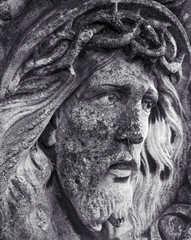 Close-up of the face of Jesus Christ on the cross. The biblical story of God's suffering