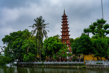 Tranquil Pagoda by the Lake under Overcast Skies in Hanoi, Vietnam