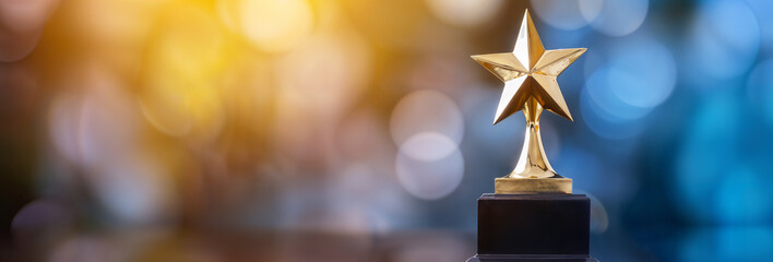 Golden award trophy star on a bokeh background, space for text, copyspace banner winner and 1st place concept, hd