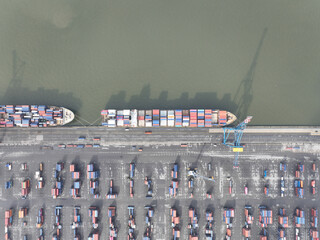 Aerial top down on container ship in the port of Antwerp, Belgium. Port full of containers rady for loading and unloading. - obrazy, fototapety, plakaty