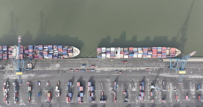 Aerial top down on container ship in the port of Antwerp, Belgium. Port full of containers rady for loading and unloading.