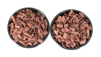 Delicious chocolate shavings in bowls isolated on white