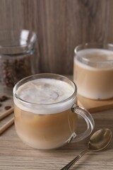 Cup of fresh coffee on wooden table