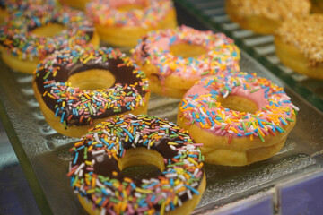 donuts on display in a coffee shop
