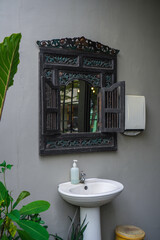 hand washing sink with retro mirror outdoors