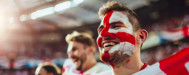 Foto op Canvas Happy English male supporter with face painted in English flag consists of a white field (background) with a red cross, English male fan at a sports event such as football or rugby match © Pixelmagic