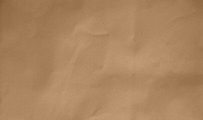 close up crumpled brown kraft paper background showing crease texture with blank space for design. flat crumpled cardboard brown paper with grain texture. - obrazy, fototapety, plakaty