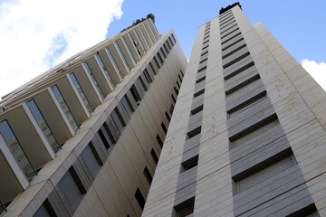 Modern appearance of high-rise buildings and structures made of glass and concrete. © shimon