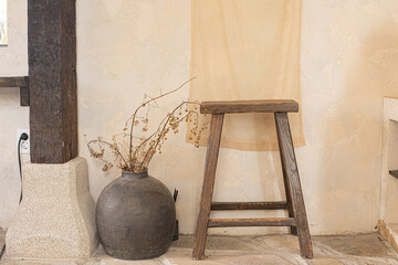 brown ceramic vase with natural brown wooden stool