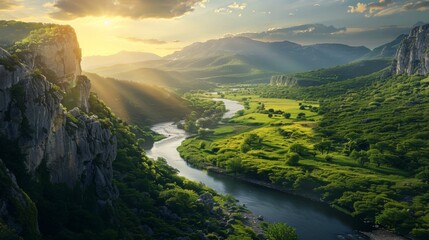 In the scene, a broad valley unfolds, cut through by a meandering river that glimmers under the sunlight. The valley is lush with green foliage, surrounded by distant hills and a clear sky above.