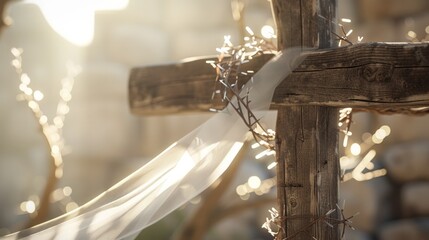A wooden cross a white veil a crown of thorns