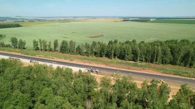 Construction of a new highway, aerial shot. Road works. Road construction, drone view. Laying asphalt