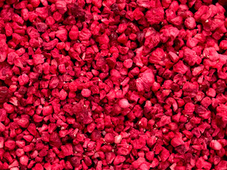 Dried freeze-dried raspberries close-up view from above. background