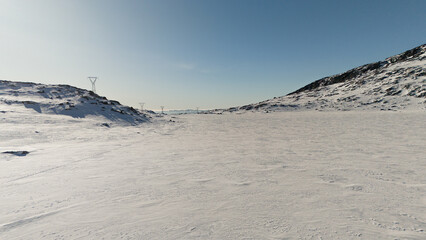 Drone shot of winter mountain landscape terrain, in Greenland
