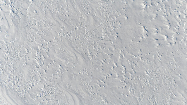 Bird's-eye view of, texture of a flat snowy surface - Snow texture from aerial view.
