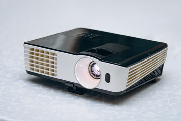 multimedia lcd projector on white table for video presentations