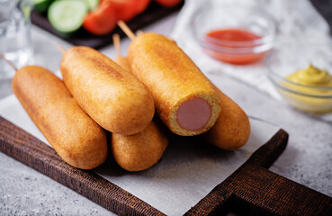 Corn dog. Asian hot dog with sauces. Street food