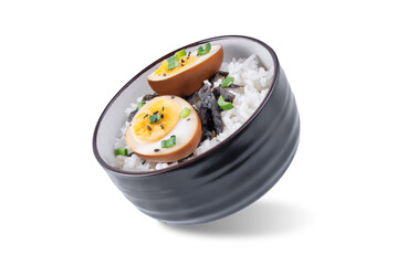 Tamago soy sauce eggs with rice and nori on a white isolated background