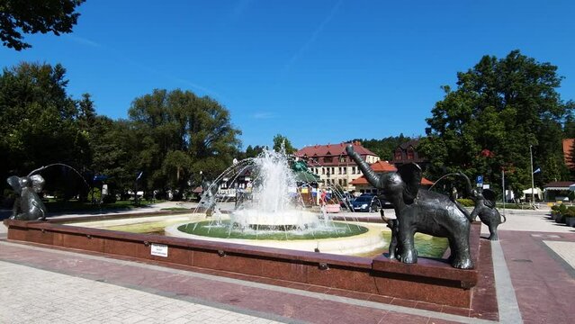 Rabka Zdroj, Poland  11 09 2023:  Fountain with elephants in front of main building of health resort Rabka Zdroj, Poland