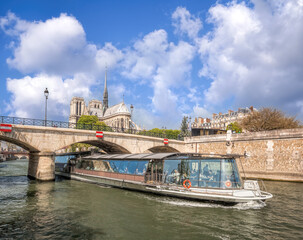 Paris, Notre Dame cathedral with boat on Seine in France - 762658065
