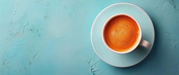 Foto op Plexiglas A Cup of Coffee on Blue Table © ArtCookStudio