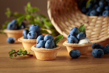 Small tartlets with fresh blueberries and mint.
