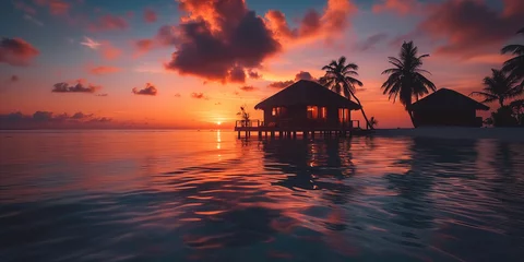 Fototapeten colorful sunset over the luxury ocean resort on tropical island © Anna