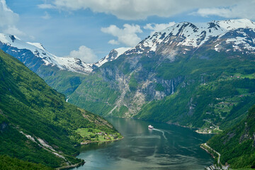 Beautiful Geiranger Fjord is a well known and popular travel destination for cruise ships and...