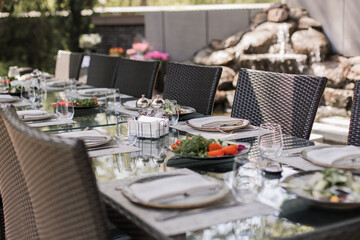 Fresh garden salad on an elegantly set outdoor dining table, perfect for al fresco dining experiences