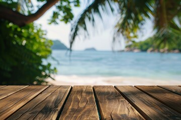 Empty wooden planks table against a blurred background with a sea coast with palm trees during the day