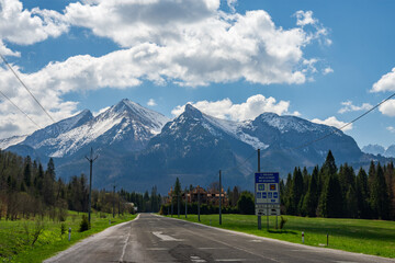 Polish Slovak border in Jurgow, Malopolskie. Tatra Mountains seen at the end of empty road from...